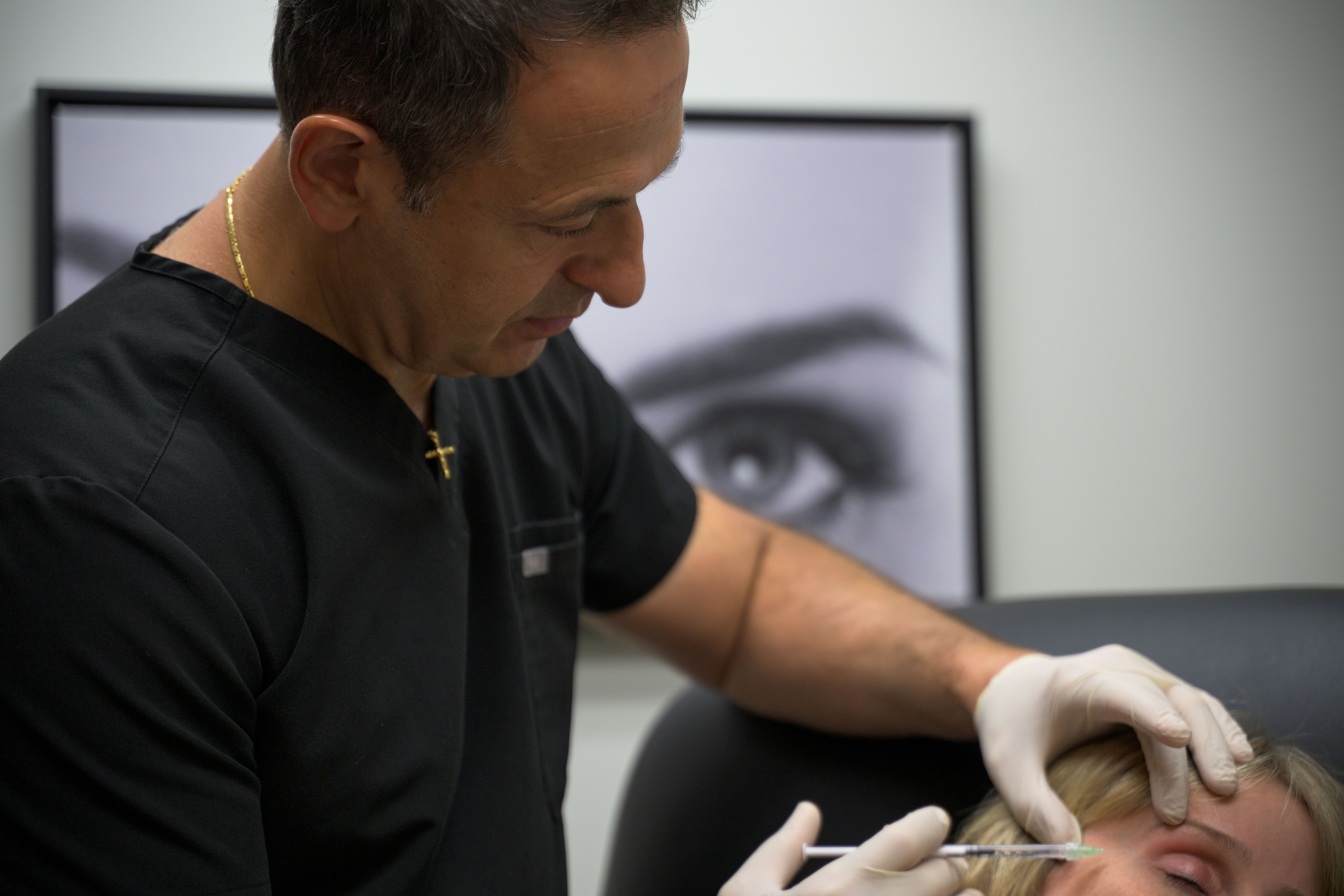 Dr. Merheb giving botox to a patient